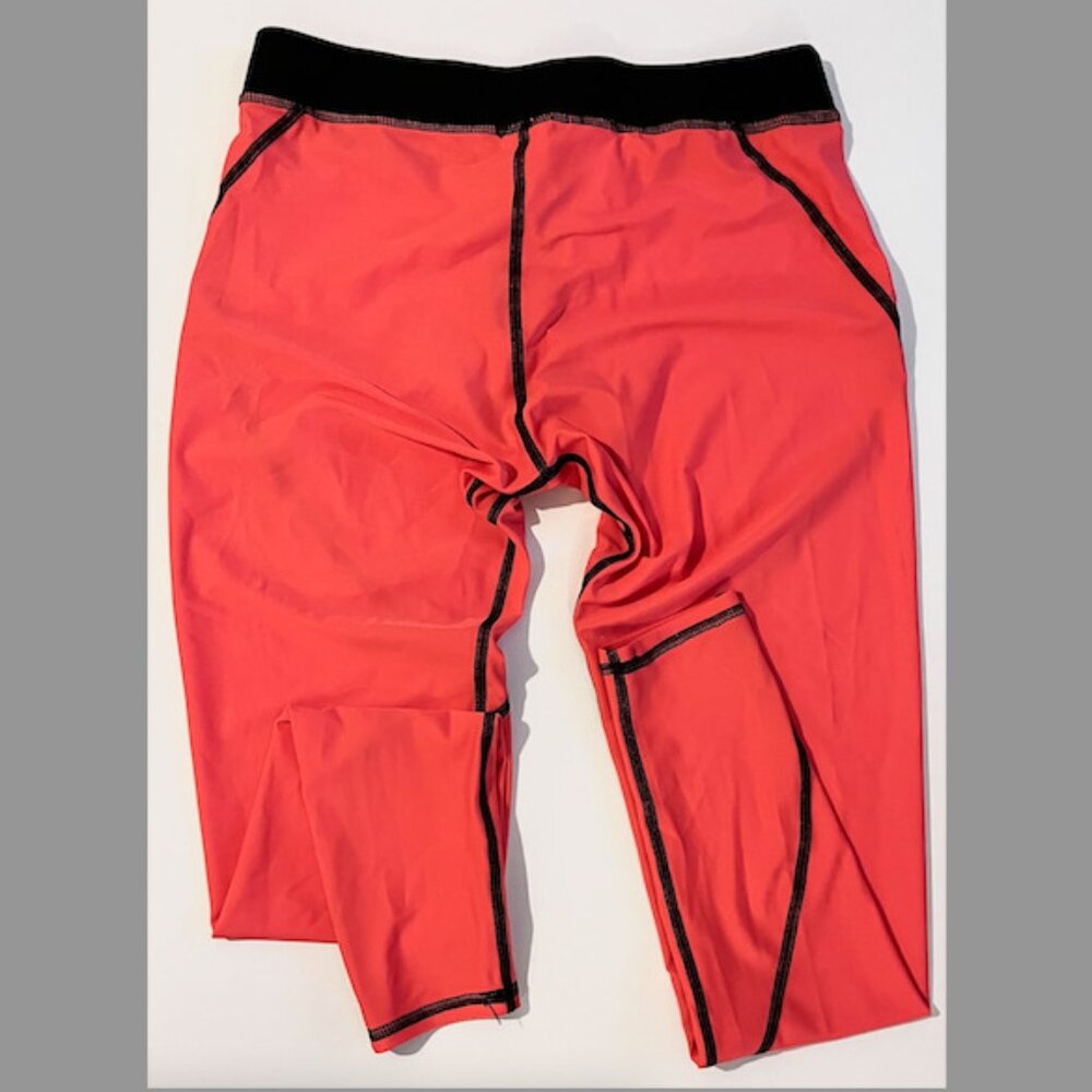 Salt Gypsy Surf Paddle Leggings in Bright Melon Orange color w/Black trim